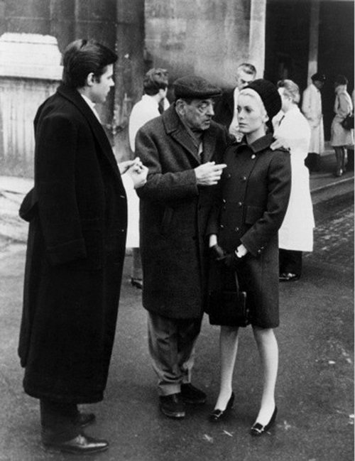 BELLE DE JOUR, Luis Bunuel (center), Catherine Deneuve (right), 1967