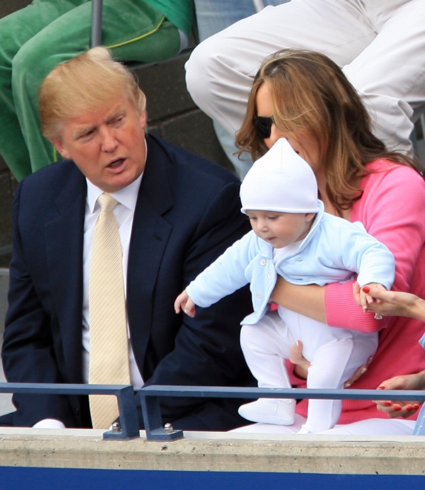 NEW YORK - SEPTEMBER 10: Donald Trump, baby son Barron and wife Melania Trump watch the men's final between Roger Federer of Switzerland and Andy Roddick during the U.S. Open at the USTA Billie Jean King National Tennis Center in Flushing Meadows Corona Park on September 10, 2006 in the Flushing neighborhood of the Queens borough of New York City. (Photo by Jamie Squire/Getty Images)